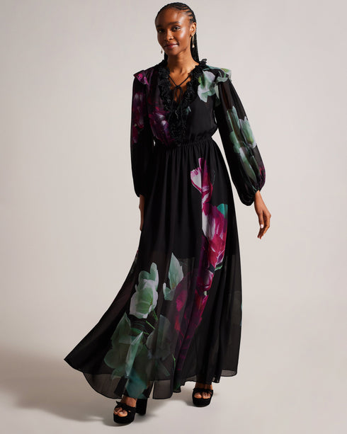 GIONNNA-Dresses-GIONNNA is all about the floaty silhouette. With a deep V-neck adorned with flowers, it's just the right amount of flirty and feminine. Whether you're attending a garden wedding or a summer soiree, this maxi dress is a stunning choice. Maxi dress Floaty silhouette Embroidered flowers on neckline Deep V-neck Fitted waist Blouson sleeve Frill details Effortless eleganceAn enchanting floaty silhouette and blouson sleeves offer a relaxed silhouette and capture the essence of timeless style.Whims